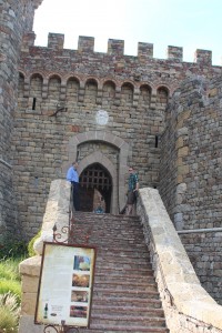 Mr. Dr. and Luke standing at the top of the stairs, about to go over the drawbridge into the castle.